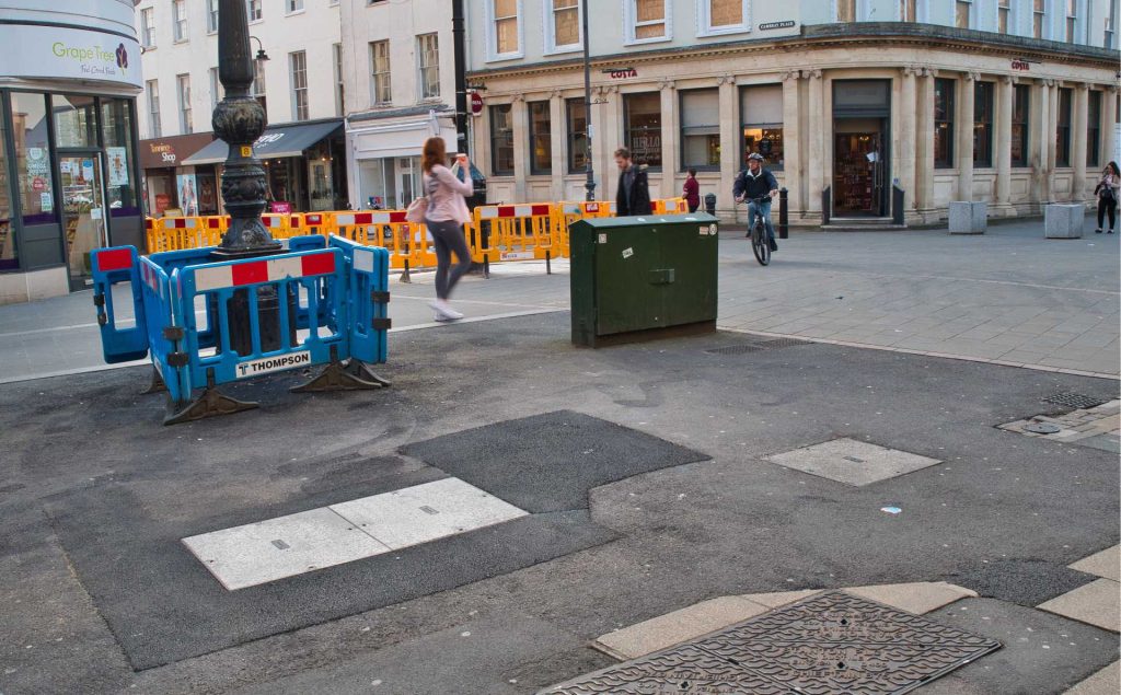 Just one view of the tarmac patchwork quilt and abandoned barriers that spoil our town centre